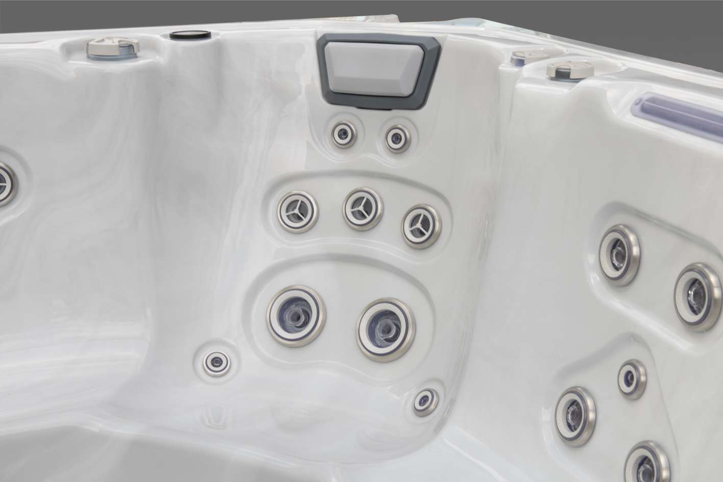 Oasis hot tub multi-level therapy seat with pillow headrest and multiple targeted jets.