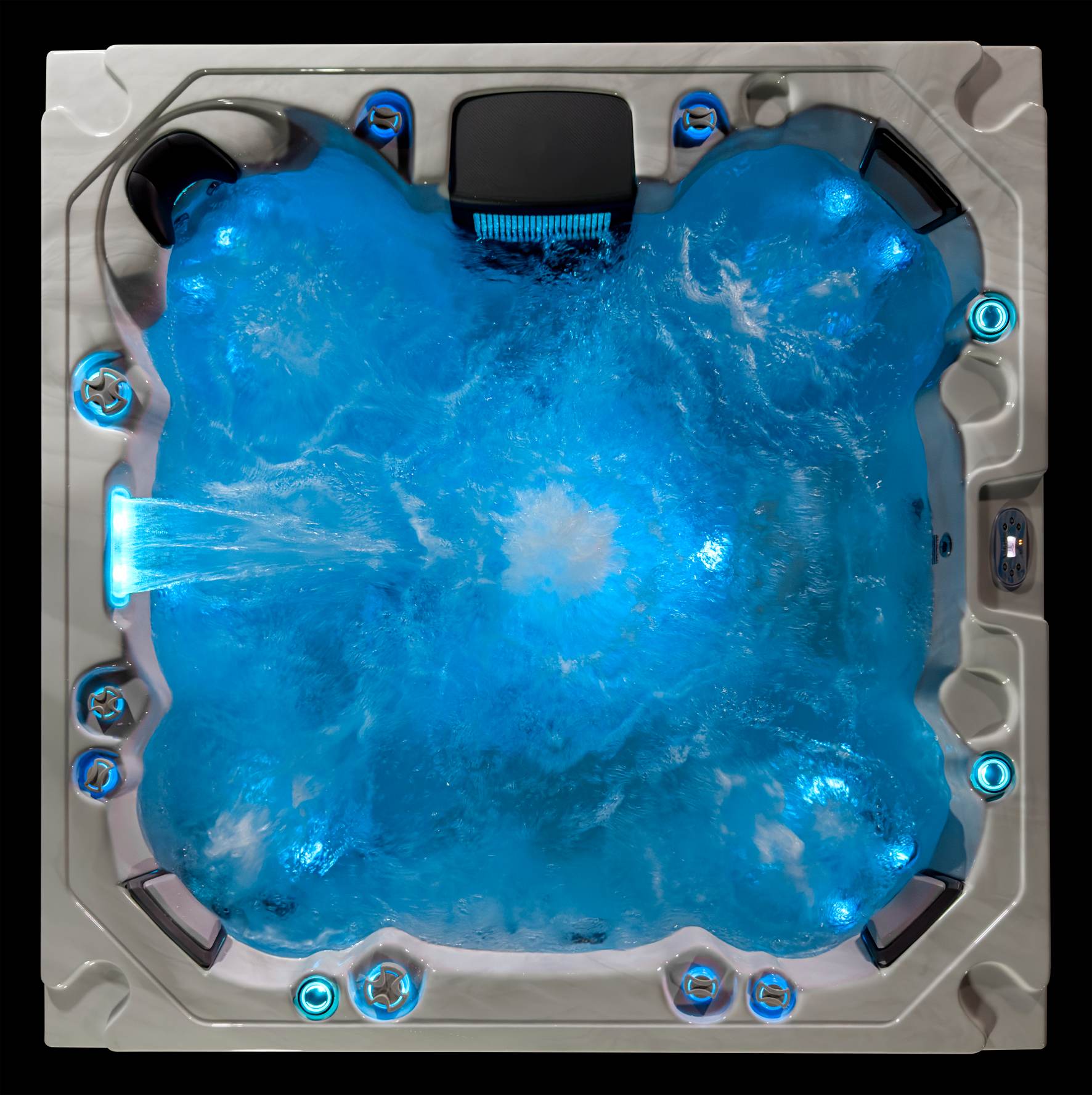 Oasis hot tub top view with strong jet motion and bright blue LED lighting.