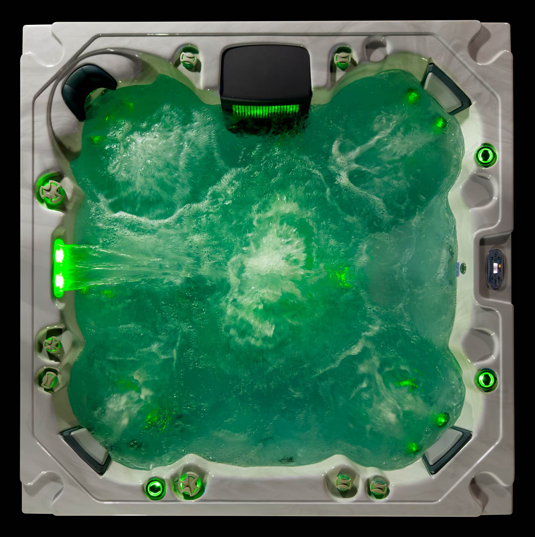 Oasis hot tub top-down view illuminated with green LED lighting and swirling jet movement.