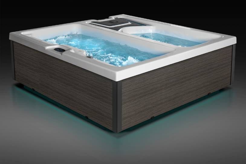Water-filled Fire & Ice therapy tub with illuminated base and bubbling hot section.