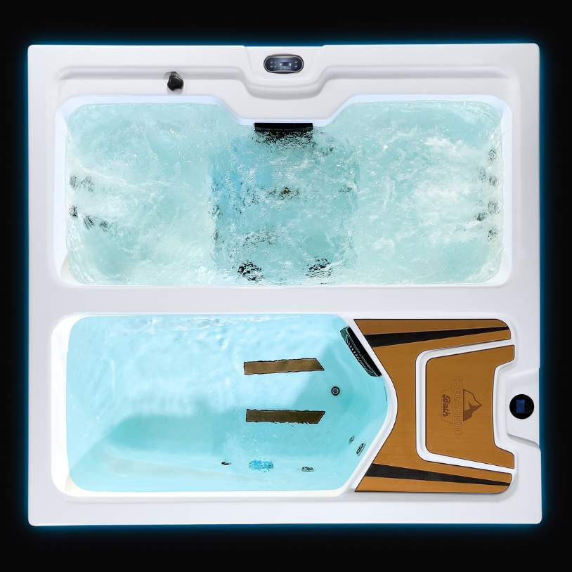 Top view of Fire & Ice dual-zone therapy tub with blue lighting and active water flow.