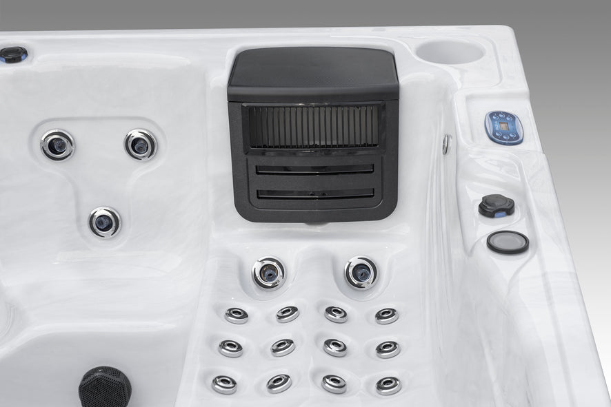 Close-up view of the Fjord hot tub jet seat area with adjustable jets and headrest.