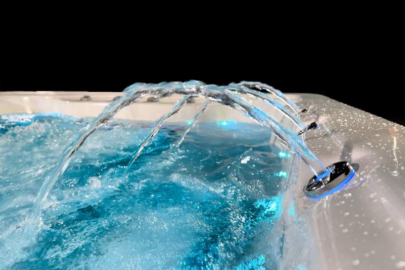 Arched water fountain jets illuminated with LED lighting on the Fossa 3B.
