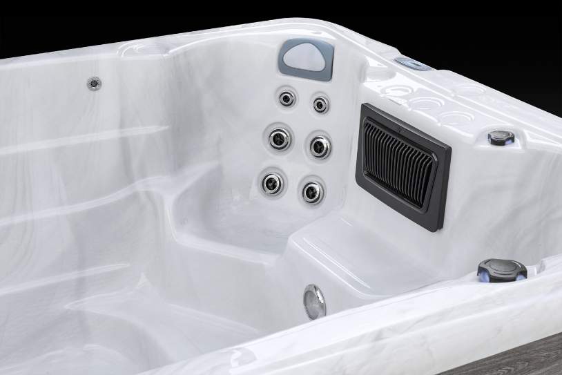 Fossa PP alternate side-angle view of Icelandic swim spa jet system inside glossy white shell.