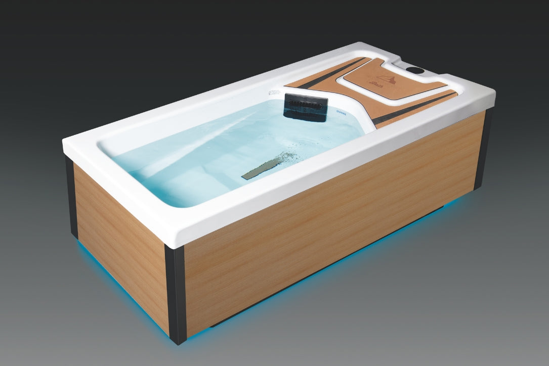 Angled view of Icelandic cold plunge with wood exterior panels and tub filled with clear circulating water.