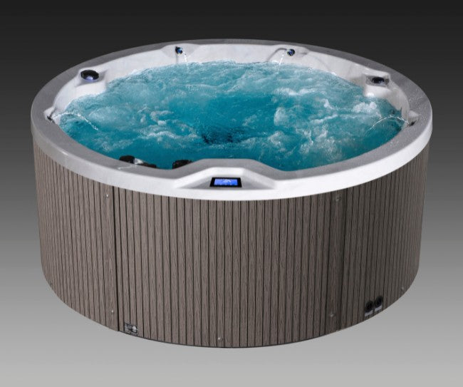 Front view of Icelandic Cyclone 3 spa with jets running and bright blue circulating water.
