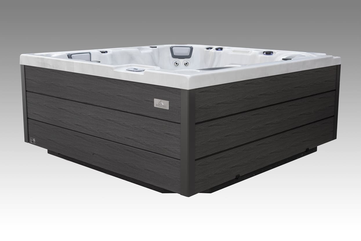Icelandic Wellness Fjord hot tub shown from an angled exterior view with dark cabinet and white interior.