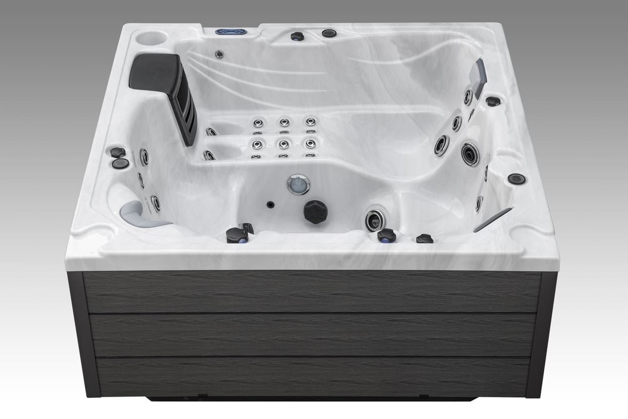 Angled close-up of the Icelandic Wellness Fjord hot tub showing premium jets and shell design.