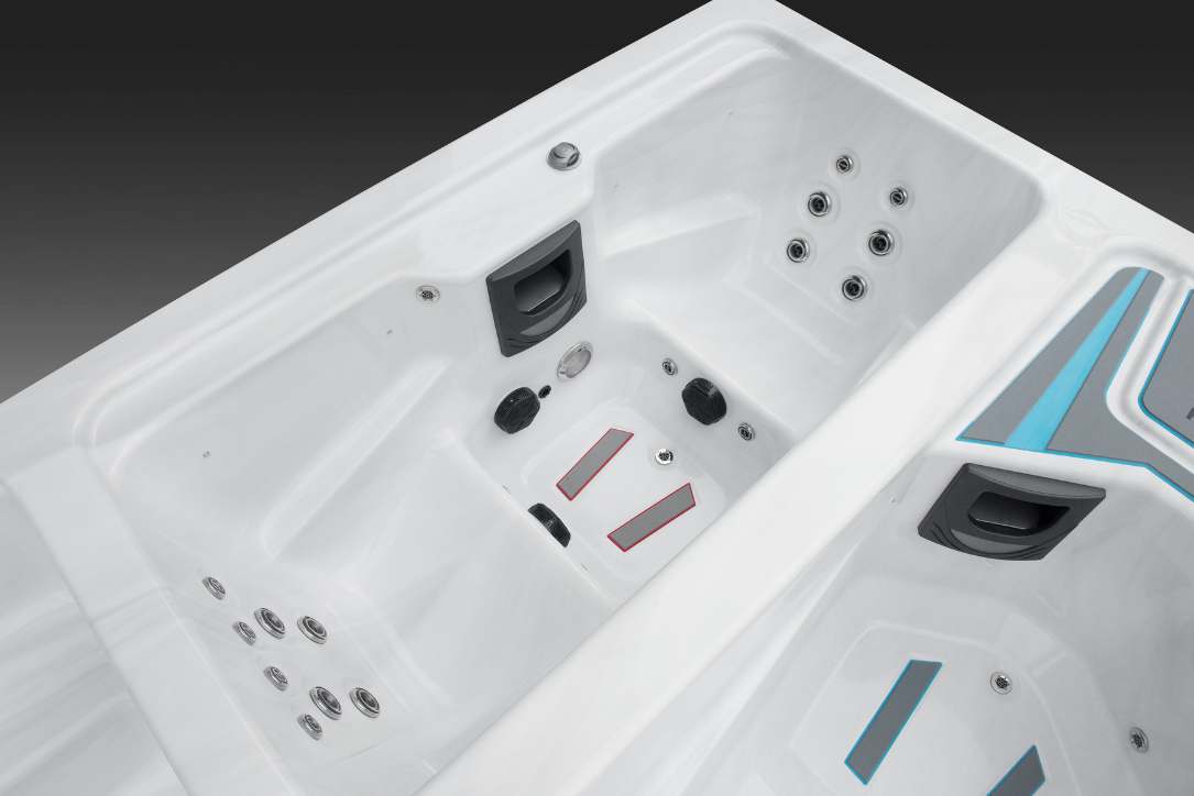 Close-up interior view of the Triathlon hot tub seat area showing jets and ergonomic seating.
