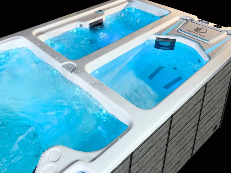 Triathlon spa ice tub and hot tub chambers with illuminated water and ergonomic seating.
