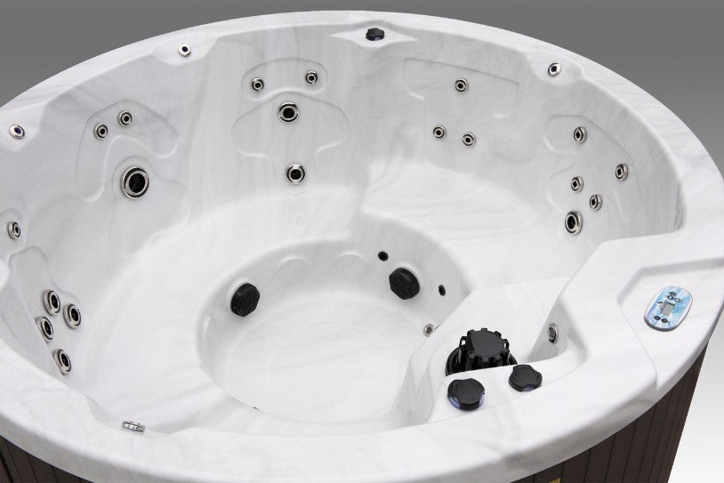 Angled interior photo of the Cyclone 1 spa highlighting jet placement, seating contours, and footwell design.