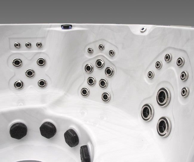 Close-up view of the Icelandic Cyclone 3 spa showing multiple hydrotherapy jets along the interior wall.