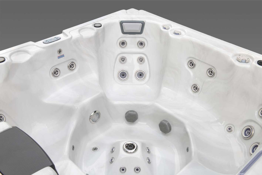 Deep therapy seat inside the Oasis hot tub featuring upper back jets, mid-back jets, lower spine jets, and footwell speakers.