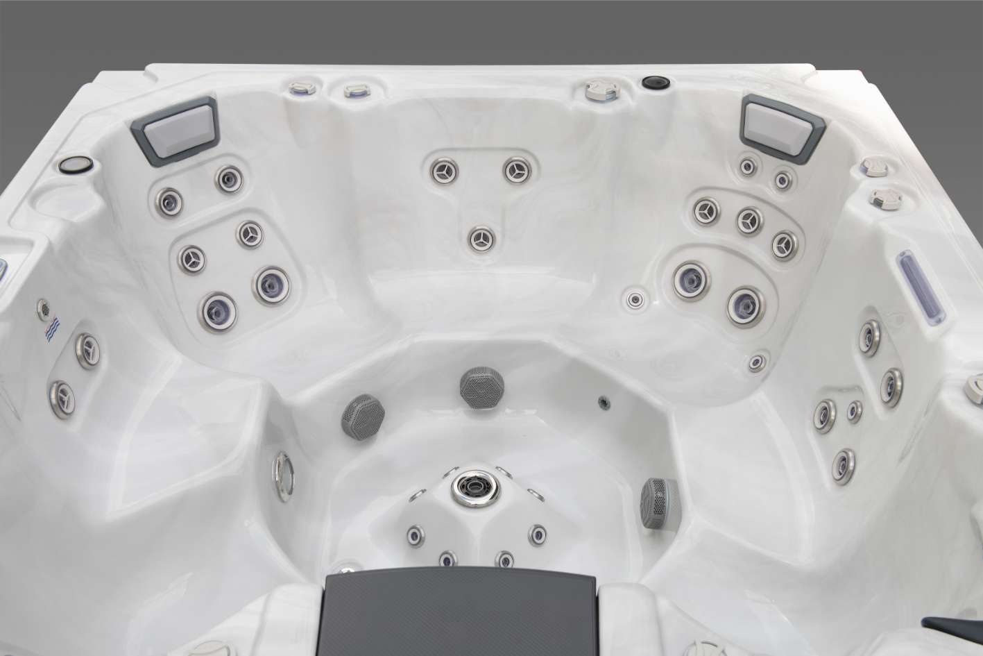 Wide interior view of the Oasis hot tub showcasing the full seating layout, hydrotherapy jets, foot dome, and headrests.