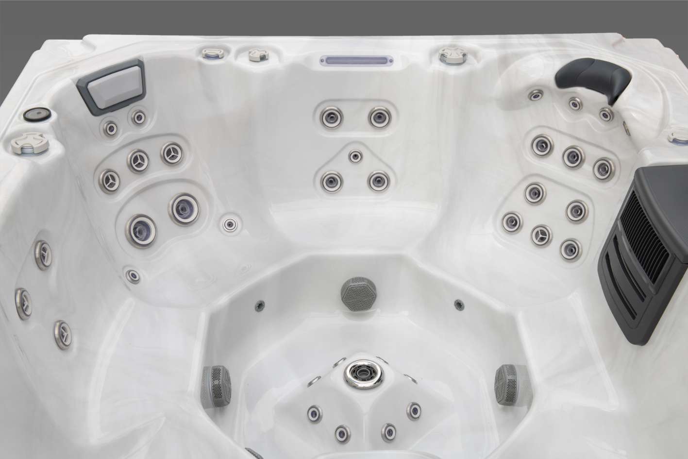 Wide view of the Oasis hot tub interior showing multiple seating positions and jet groupings.