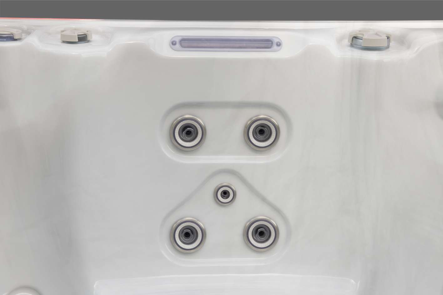 Oasis hot tub back wall jet cluster featuring five stainless steel hydrotherapy jets.