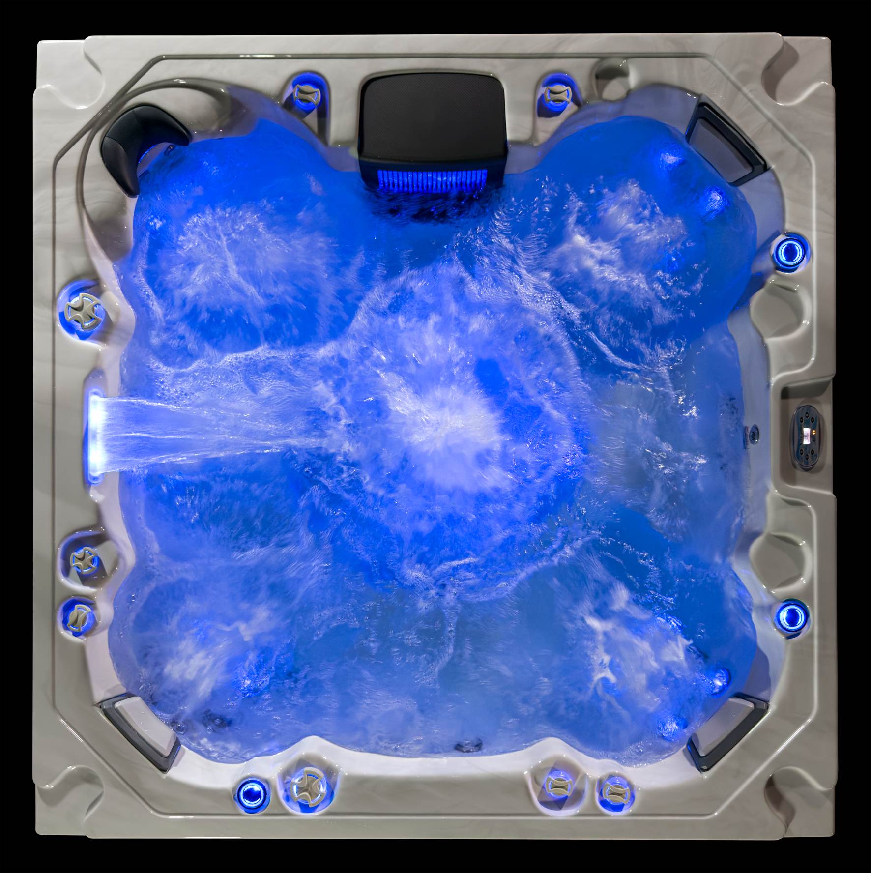 Oasis hot tub with deep blue LED lighting and vigorous hydrotherapy jet action.