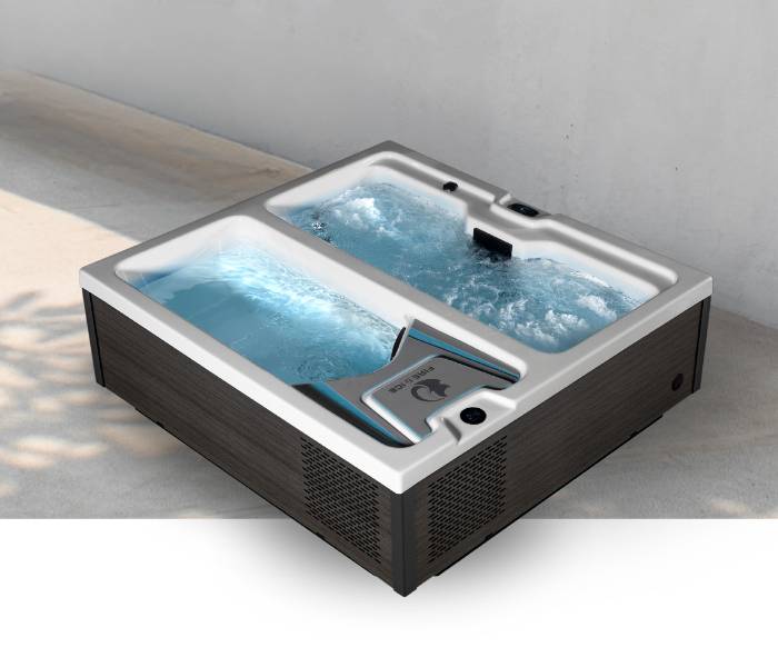 Fire & Ice dual-zone therapy and plunge tub filled with water in an outdoor setting.