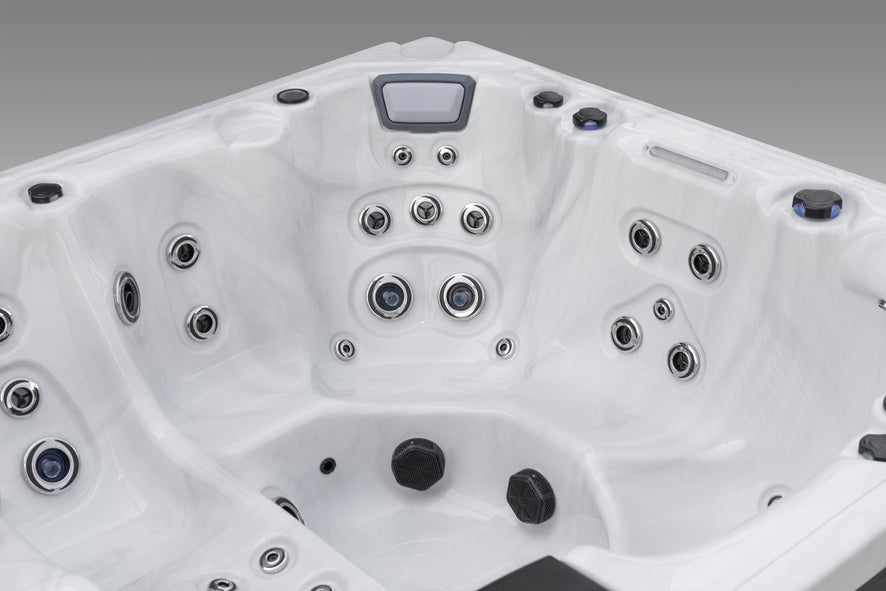 Fjord hot tub interior with ergonomic seats and a variety of adjustable hydrotherapy jets.