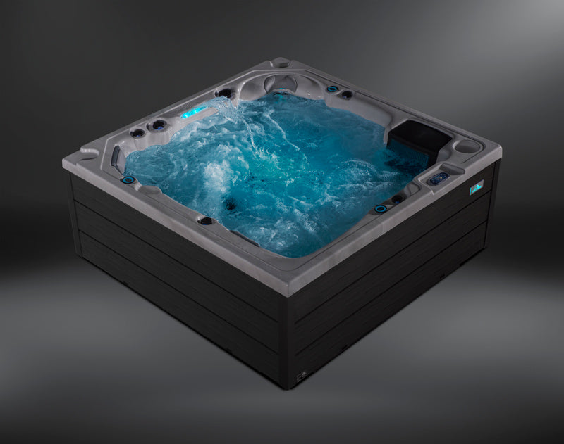 Isometric corner angle of the Fjord hot tub showing bubbling water and LED lighting.