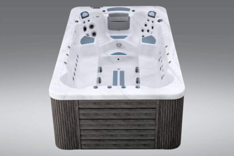 Front view of the Fossa 3B swim spa with dual lounge seats and hydrotherapy jets.