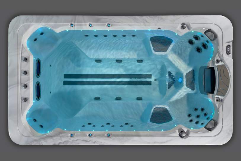 Fossa-3B swim spa from above with still water highlighting interior seating and swim lane markers.