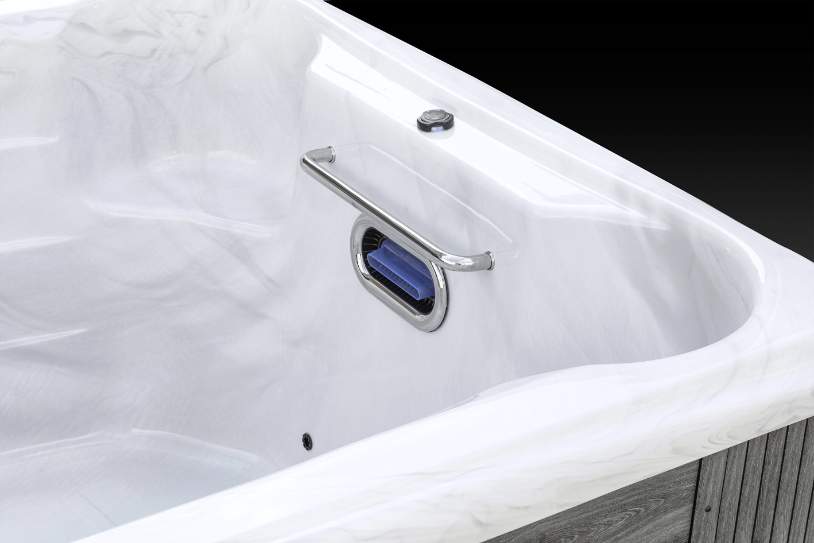 Fossa PP interior corner of Icelandic swim spa featuring handrail and embedded swim jet.