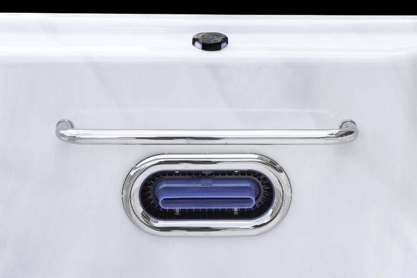 Fossa PP close-up of Icelandic swim spa handrail and oval swim jet against a white acrylic surface.
