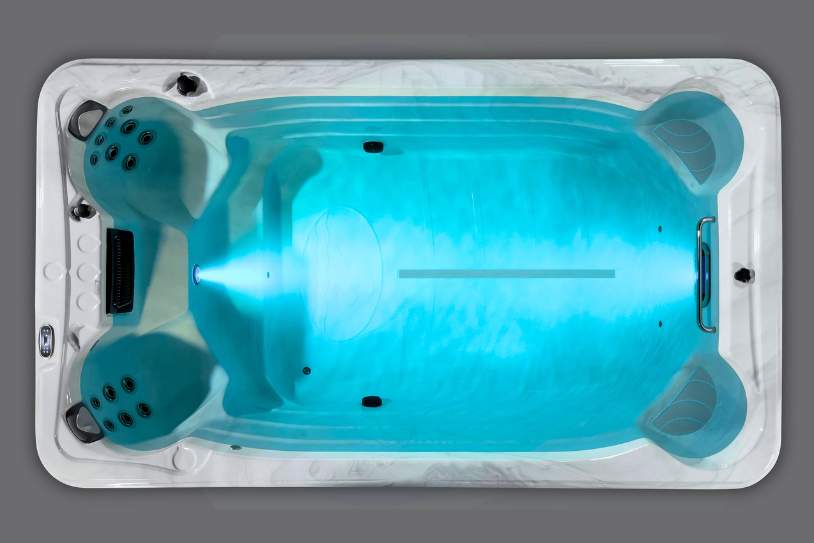 Fossa PP overhead view of a swim spa with deep blue lighting and a strong water current in motion.