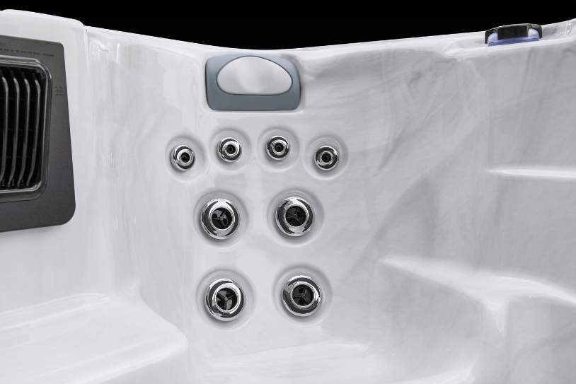 Icelandic Fossa PP hydrotherapy jet cluster inside the Icelandic Swim Spa showing stainless steel jets and seating contour.