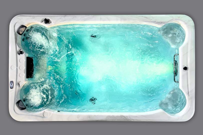 Fossa PP overhead shot of the Icelandic Swim Spa with illuminated blue water and strong jet circulation.