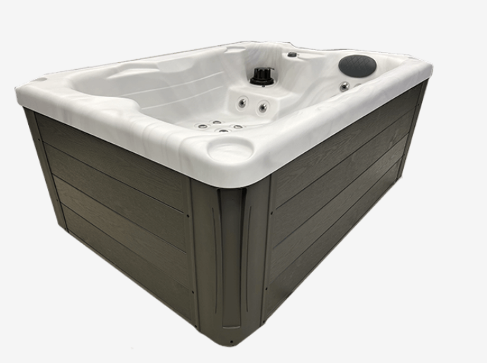 Side view of the Harmonic H157Lpp hot tub showing gray exterior panels and white acrylic interior.