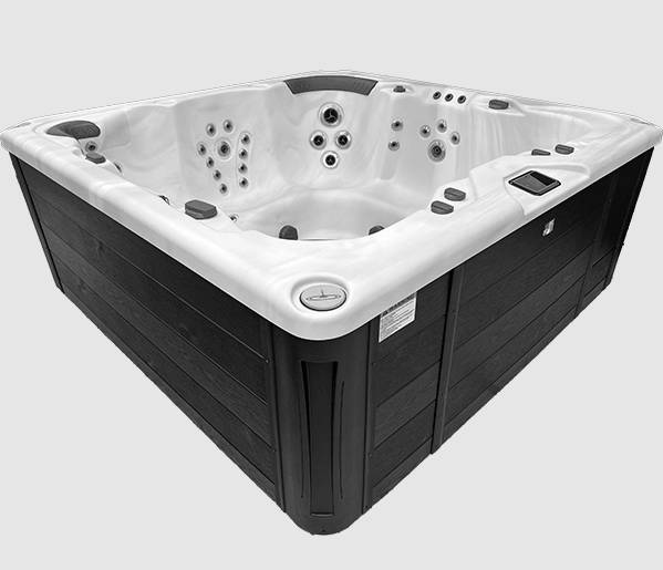 Outdoor hot tub with white acrylic interior and dark cabinet shown in angled side view.