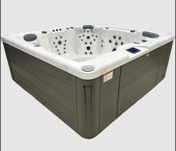 Side view of the Harmonic H288L hot tub featuring a white acrylic shell and grey exterior cabinet.
