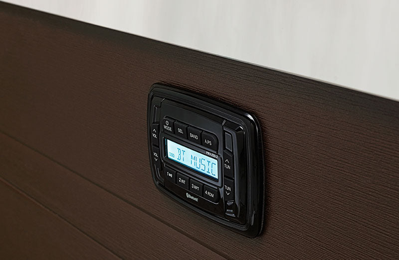 Bluetooth music control panel mounted on the exterior cabinet of a hot tub.