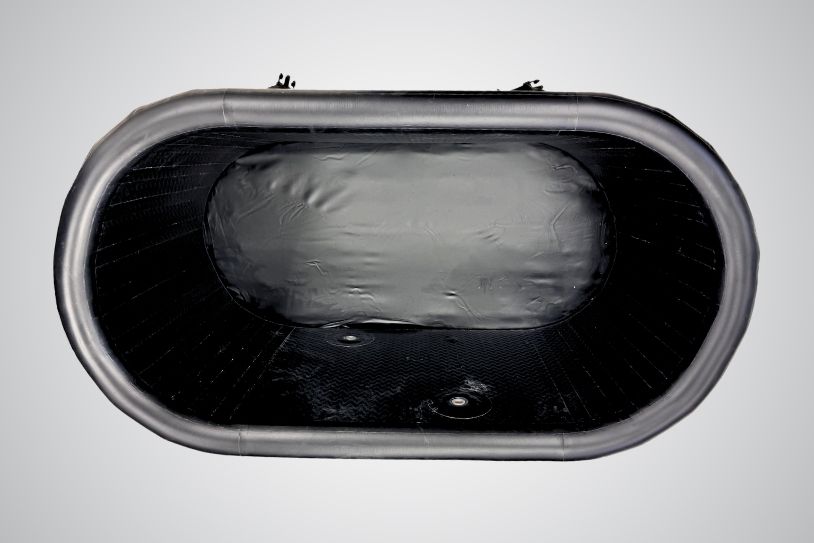 Top-down view of the empty Icelandic Air tub interior showing the black insulated inner lining.