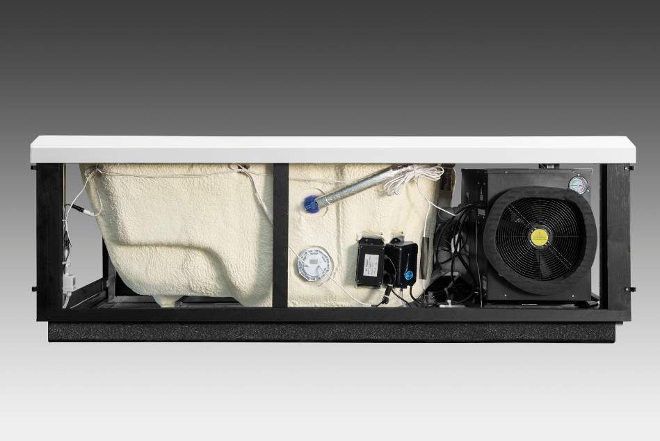 Full-length interior system of Icelandic cold plunge showing insulated tub bottom, wiring, pump, and fan assembly.
