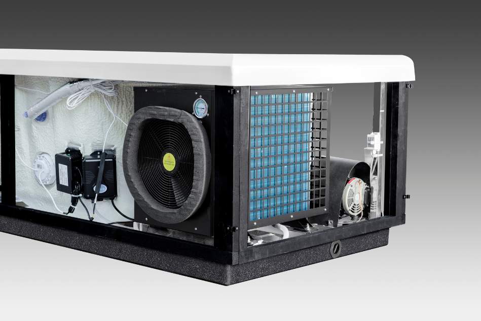 Close-up of the Icelandic cold plunge compressor motor and surrounding internal components.