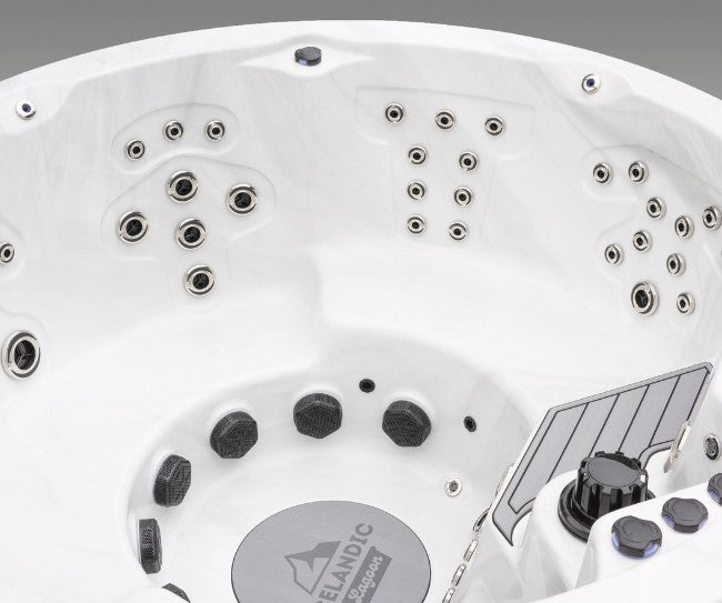 Interior view of the Icelandic Cyclone 3 hot tub showing multi-zone hydrotherapy jet configurations.