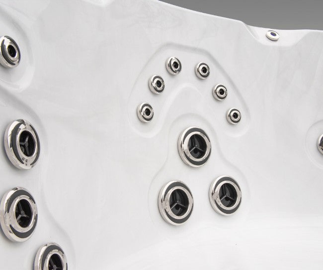 Close-up of the upper jet panel inside the Icelandic Cyclone 3 spa showing directional stainless-steel jets.