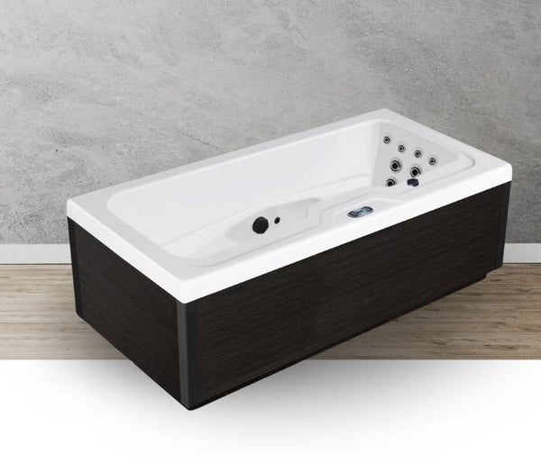 Icelandic Fire black-panel whirlpool tub displayed in a modern bathroom interior.