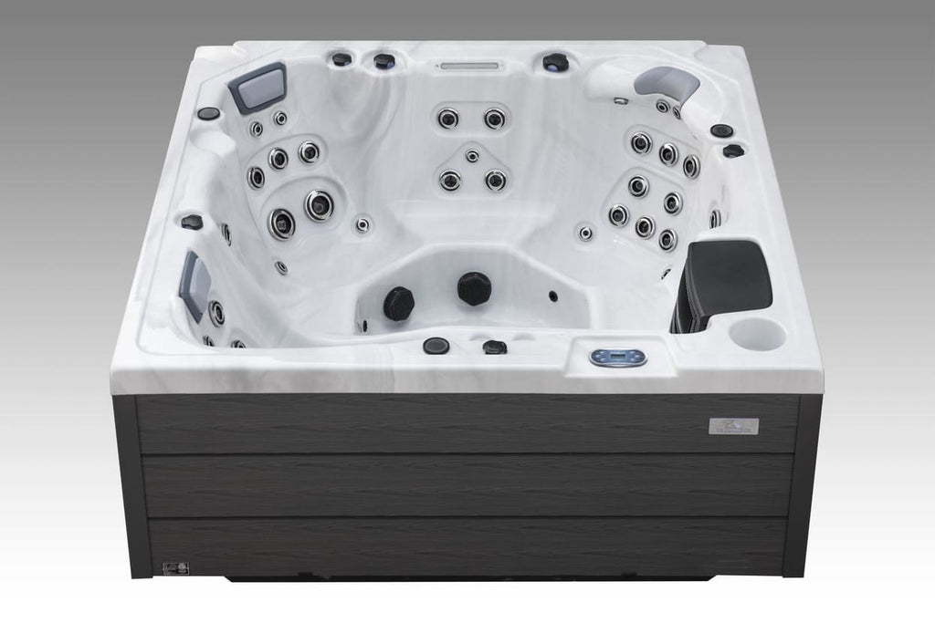 Front view of the Icelandic Wellness Fjord hot tub highlighting seating layout and hydrotherapy jets.
