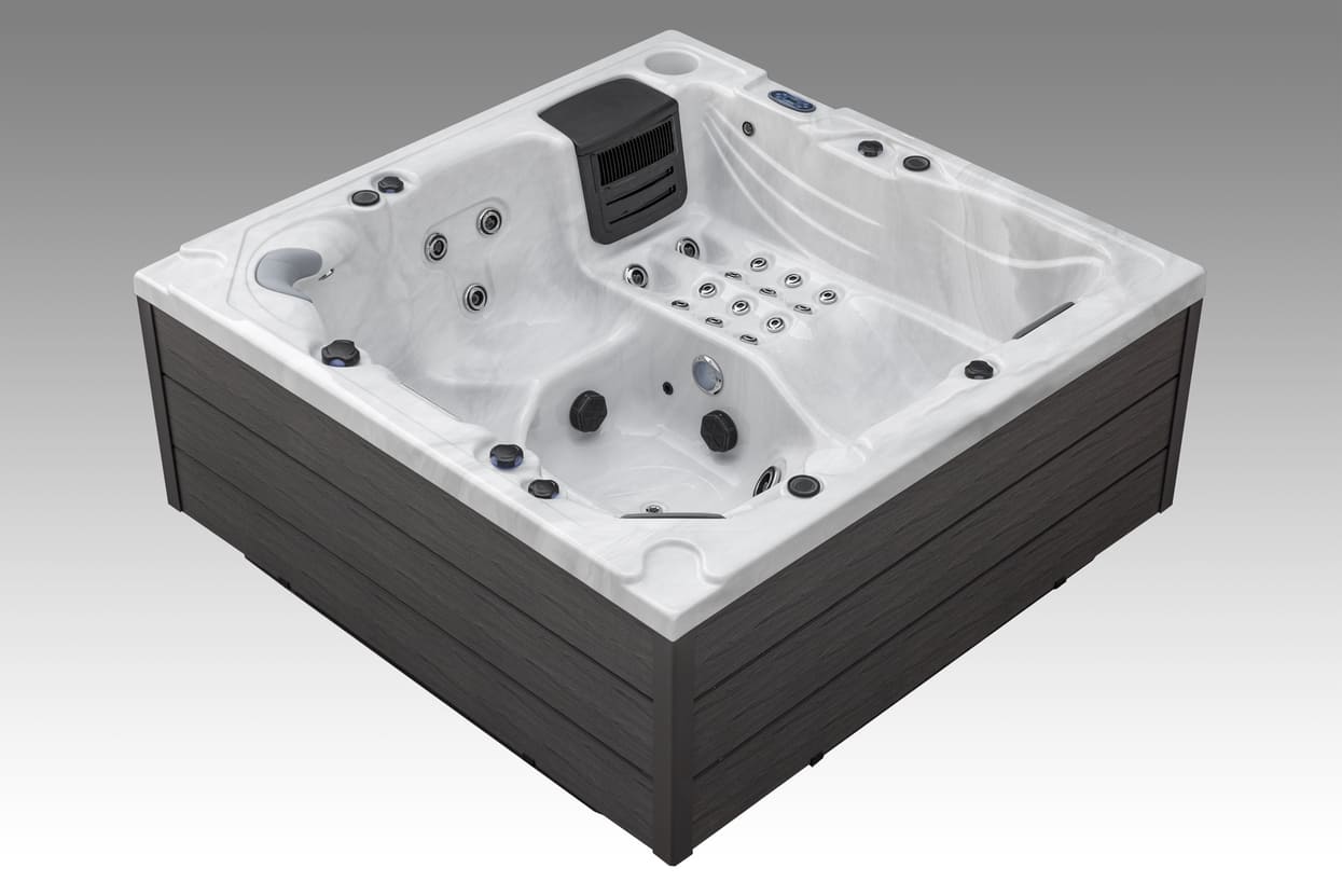 Side profile of the Icelandic Wellness Fjord hot tub with ergonomic lounge seating and hydrotherapy jets.