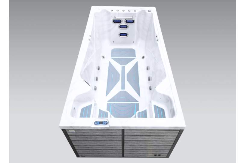 Front angled view of the Icelandic swim spa highlighting jets, controls, and swim lane design.