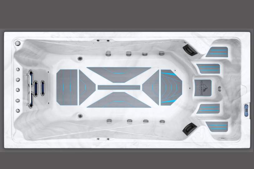 Top-down view of the Icelandic swim spa interior showing jets, seating, and non-slip floor pattern.