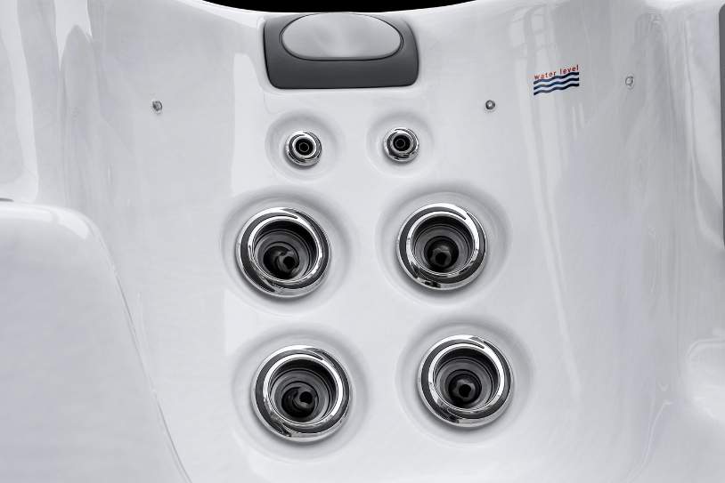 Cluster of stainless steel hydrotherapy jets inside the Fossa-3B swim spa.