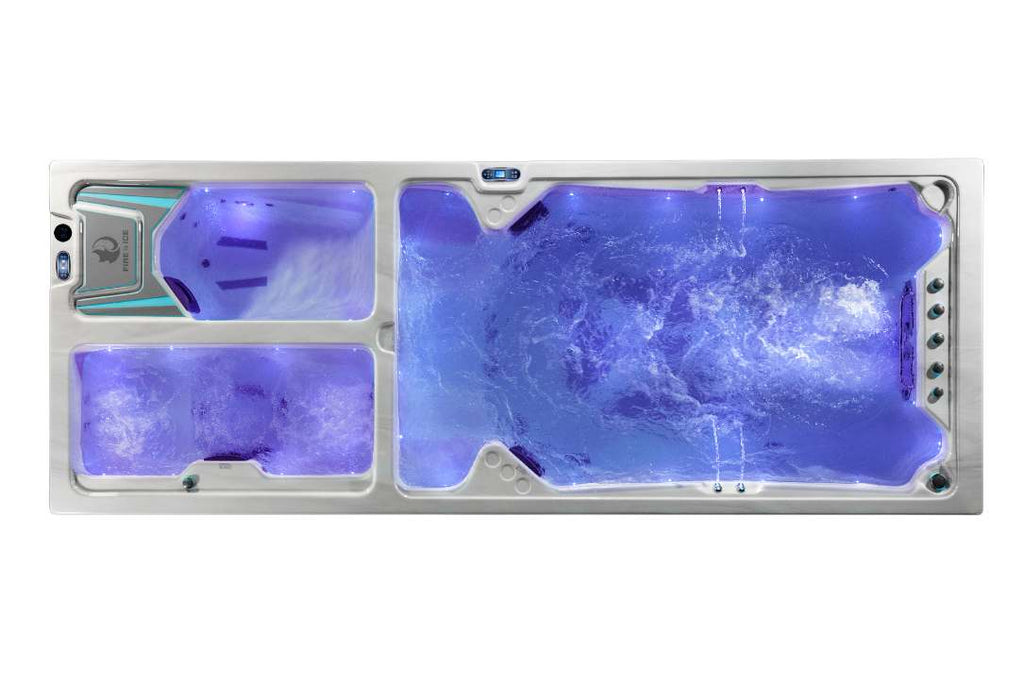 Triathlon 3-in-1 swim spa overhead view illuminated with purple LED lighting.